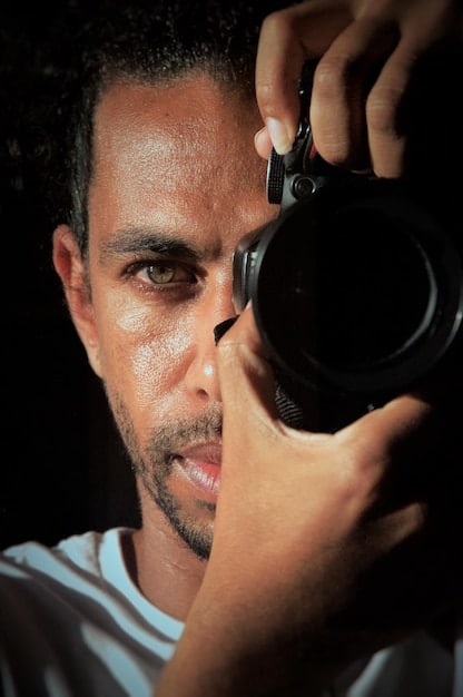 A close-up shot of a movie director on a Brazilian film set, intensely focused while giving instructions to actors amidst a bustling crew, showcasing the passion and dedication behind Brazilian film production.
