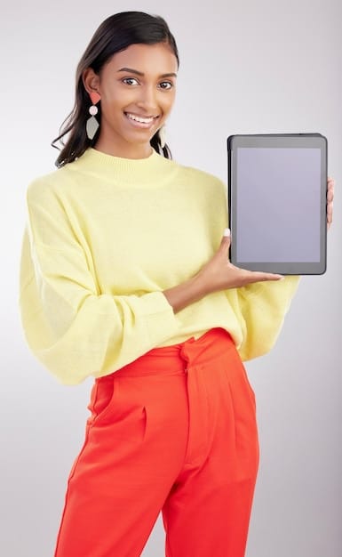 A close-up shot of a young Brazilian woman's hands holding a tablet. The screen displays a branching narrative decision point from an interactive streaming program. Text bubbles overlay the screen, showcasing different choices she can make.