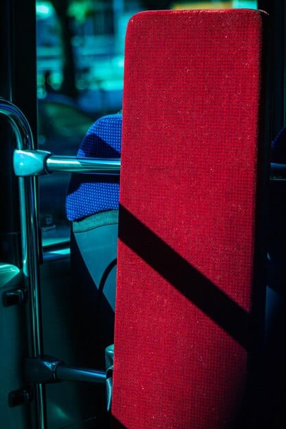 A close-up of a newly installed, plush cinema seat in Brazil, showcasing its ergonomic design, ample legroom, and reclining feature.