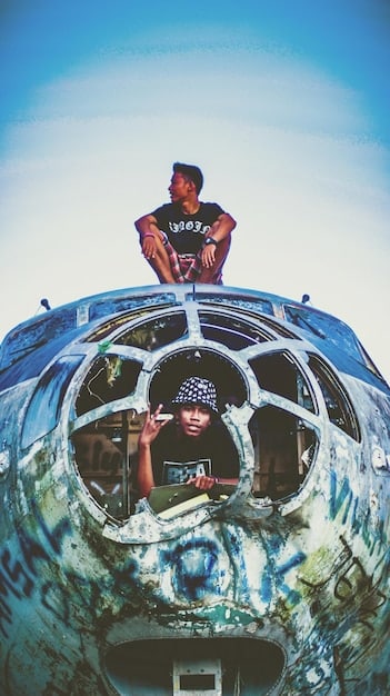 A close-up shot of two pilots in the cockpit of a B-17 bomber, with one looking concerned and the other focused on flying. The interior of the cockpit is detailed and authentic-looking, with gauges and switches visible.