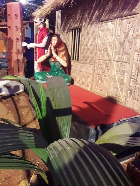 A film set in a small, traditional town in the interior of Brazil, with crew members setting up equipment while locals watch with curiosity, illustrating the blend of professional production with regional authenticity.