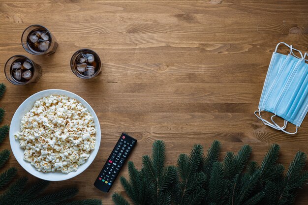 A circular table with different types of popcorn bowls and movie-themed coasters, suggesting a casual and fun movie discussion. The items are neatly arranged, showcasing community and organization.