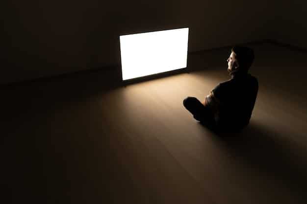 A silhouette of a person sitting in a dark cinema, captivated by a large, glowing screen, emphasizing the immersive experience of film watching. The scene conveys deep focus and absorption.