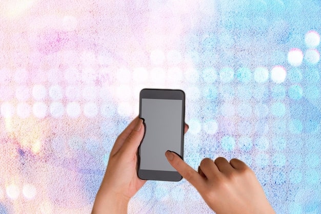 A person's hand interacting with a smartphone screen displaying a social media app, with blurred out spoiler alerts and a 'mute keywords' option visible.
