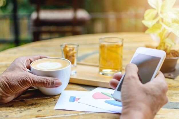 A hand holding a smartphone, with a budgeting app open on the screen showing a breakdown of monthly streaming service costs. The background is a blurred cafe scene in Brazil.