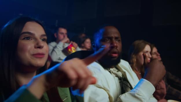 A group of people attending a government-sponsored film festival in Brazil, showcasing the efforts to revitalize the film industry. The image should be positive and show community engagement.