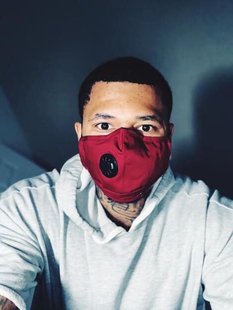 A close-up shot of the Squid Game mask worn by the Front Man, focusing on the geometric shapes and the cold, emotionless surface. The background is blurred, emphasizing the mask's central role in the games and the mystery surrounding the character. The image relates to the anticipation for the new season and the role of such characters in 'Squid Game' Season 2: Will It Live Up to the Hype? A Speculative Review