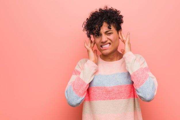 A person covering their ears while smiling, suggesting a playful attempt to avoid hearing spoilers at a movie night. Other friends are laughing nearby. This image visually represents the active avoidance of spoilers.